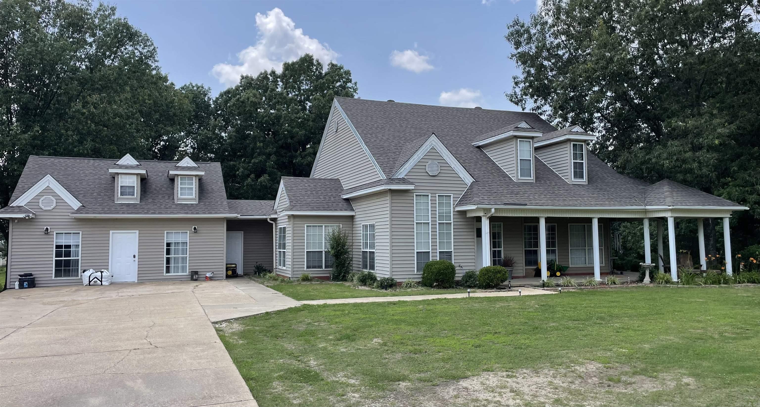 This home is located on 3.3 acres. Built in garage with full bathroom and additional space above garage. Large laundry room. Roof is 7 years old and central unit replaced 2 years ago. Large living room with gas fireplace. All electric home with two large covered porches. Storage buildings on property stay.