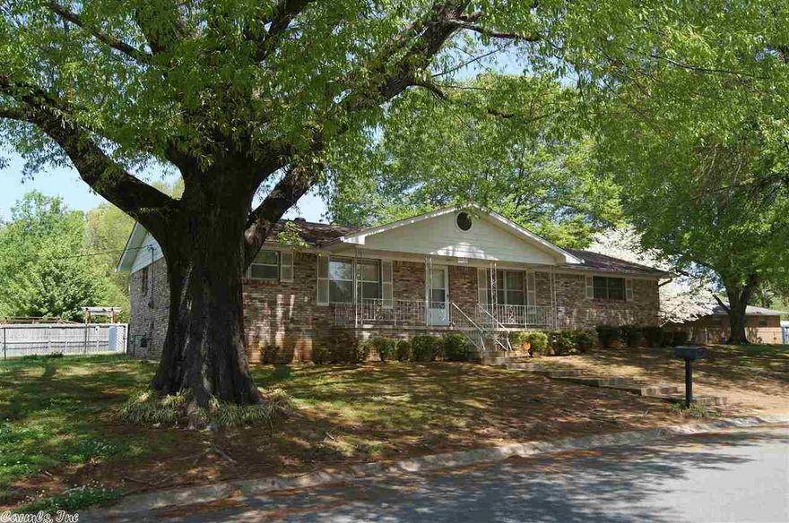 This all brick family home sits on a corner and has 2 lots. There are 3 bedrooms, 2 bathrooms, a large dining room, and separate living room. The kitchen has nice appliances and a large pantry. The bedrooms have beautiful hardwood floors. The yard has huge oak trees and lots of extra landscaping. The back yard is fenced and has a nice patio. There are 2 storage buildings. Call to see this beautiful home today!