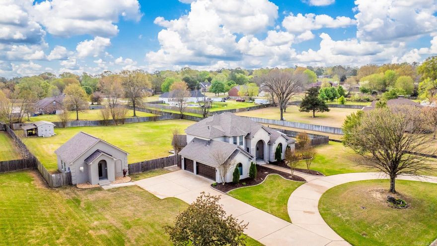 Beautiful home on large lot with inground pool and guest house (not included in sq footage).  Main level primary bedroom has sitting room with fireplace and large bath  with walk in closet.  Relaxing outdoor space with lovely pool, patio and storage area.