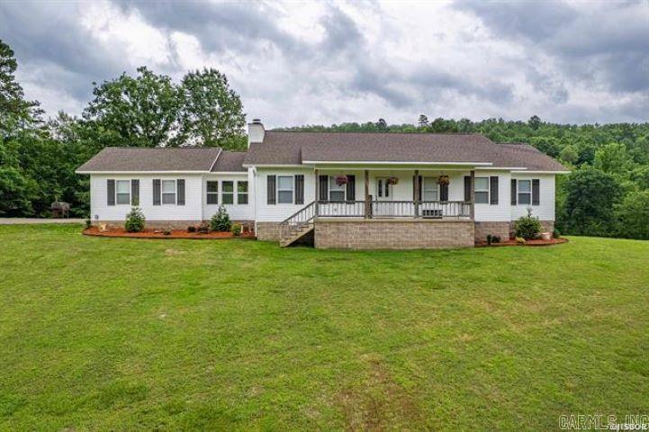 Country Living at Its Finest! Enjoy wide open spaces and serene vistas in this beautifully maintained home nestled on over 13 acres in the desirable Magnet Cove School District. With more than 2,000 square feet of living space, this charming 3-bedroom, 2-bath home offers a perfect blend of comfort and functionality. Gather around the stunning stone fireplace in the spacious living area or whip up a meal in the updated kitchen featuring a classic farmhouse sink and modern appliances. Step outside to your own private retreat: an 18' x 33' above-ground pool with a generous deckāperfect for entertaining or relaxing under the stars. A standout feature is the impressive 30' x 40' shop, fully heated and cooled, complete with its own apartmentāideal for guests, a home office, or rental income. The property also includes a handy 12' x 20' utility shed, giving you even more space for storage or projects. This is more than a homeāitās a lifestyle. Whether you're dreaming of a hobby farm, need room to roam, or simply want to soak in the beauty of country life, this property has it all.