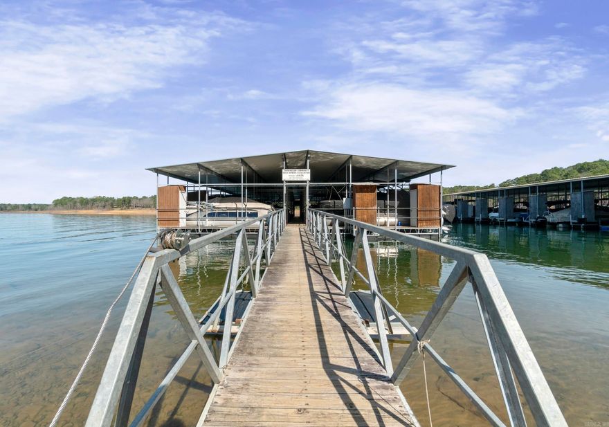 If you're looking for a great location with a lakeview then this one is for you! This 3 bedroom 2 bath home has been redone. Granite countertop and tile     backsplash, new appliances, new flooring and paint. Property also includes a 10x24 boat slip #24 with a storage locker. Boat slip is just a short walk out your driveway down the paved path to your community dock. Come and sit on your back deck and enjoy the lakeview! The POA Dues are $500 per year, Boat Dock is $950.00 per year.