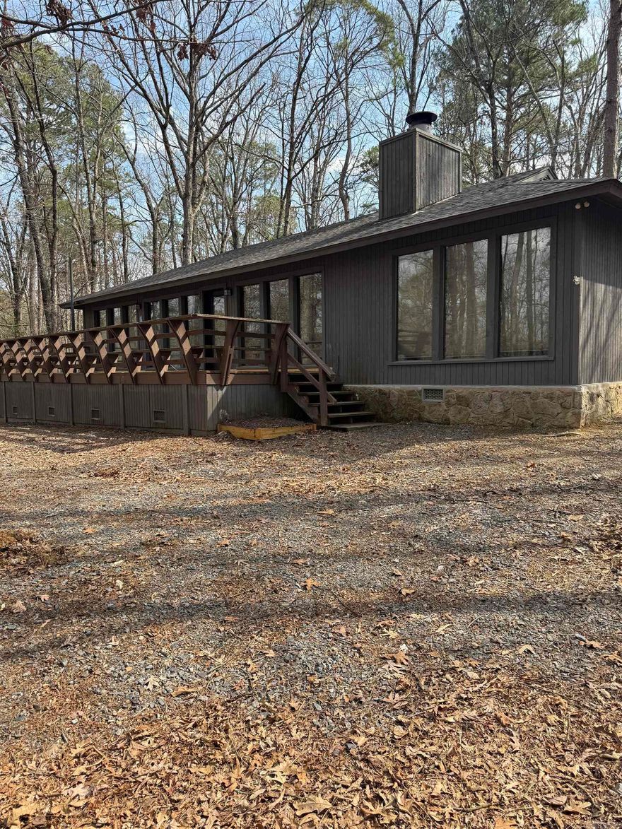 If you're looking for a great location with a lakeview then this one is for you! This 3 bedroom 2 bath home has been redone. Granite countertop and tile     backsplash, new appliances, new flooring and paint. Property also includes a 10x24 boat slip with a storage locker. Boat slip is just a short walk out your driveway down the paved path to your community dock. Come and sit on your back deck and enjoy the lakeview! The POA Dues are $500 per year, Boat Dock is $950.00 per year.