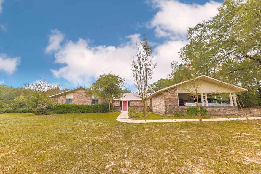 Nestled among rolling hills and open skies, this one-of-a-kind well-built and well-maintained property offers space to roam room to grow. Step inside the heart of the home, where a spacious kitchen awaits—fully equipped with generous storage, ample counter space, and a layout built for both quiet family mornings and large gatherings. Adjacent to the kitchen, a light-filled 550 sq ft sunroom becomes your personal sanctuary—seamlessly connecting the den and the primary bedroom, it's the ideal spot to sip coffee at sunrise or unwind as the sun sets. With 5 total bedrooms, including a flex room on one side of the house, complete with its own bathroom, this home offers incredible versatility, perfect as a home office, guest suite, or craft room. Sitting on 9 peaceful acres with mature trees and open land, there is a storage barn as well as two large slab-floored shops. When it’s time to relax, head outside to your in-ground pool, perfect for warm summer days and entertaining under the stars. Whether you're looking for a peaceful place to call home or a rural getaway that still offers comfort and space, this property delivers on both!