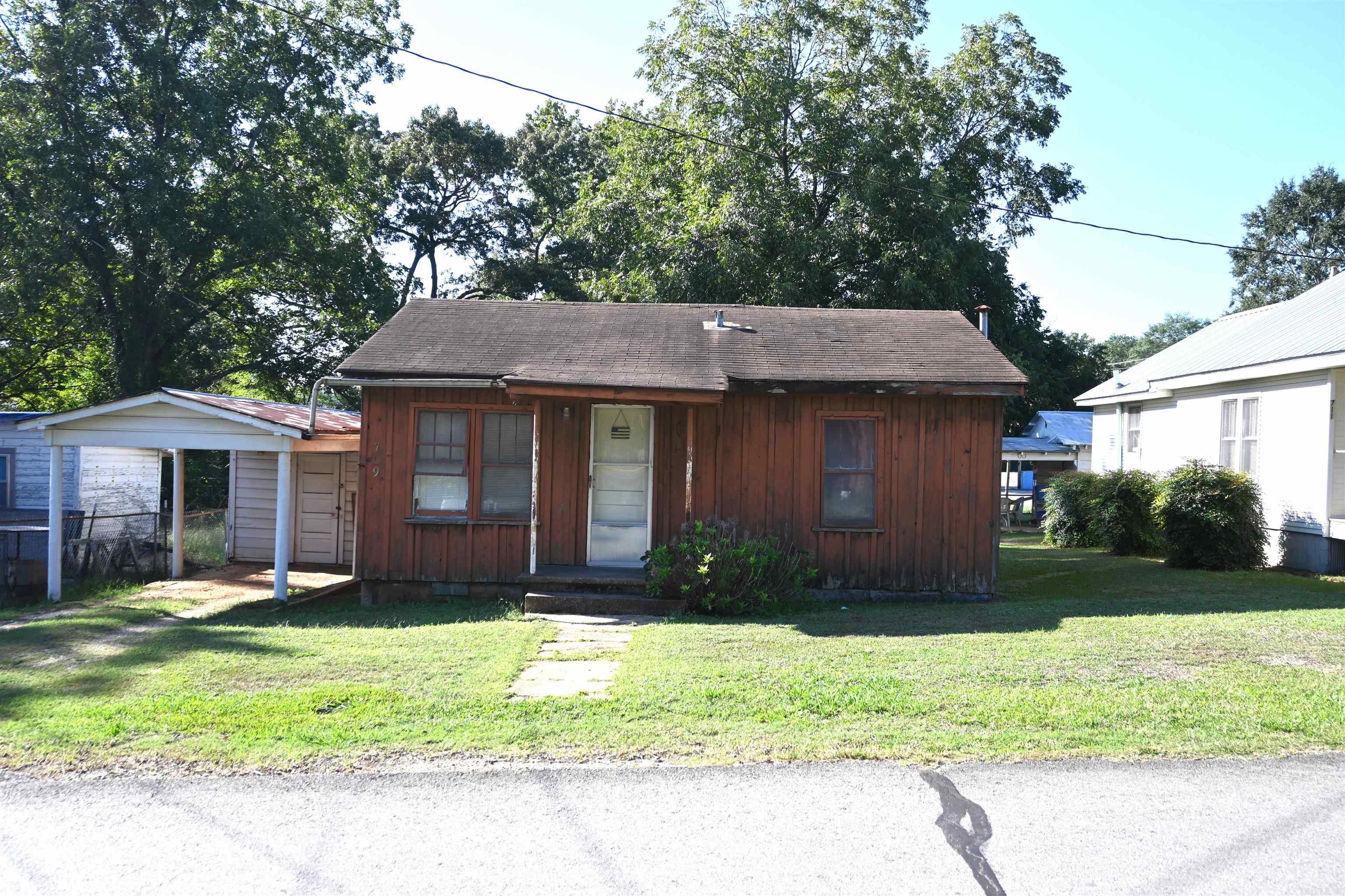 INVESTORS !!! Cute little house in the middle of Sheridan. 2 BR 1 BA complete w/ Original Hardwood Floors. Cute Jack n Jill closet between the bedrooms. Small carport w/ storage room. Lots of potential for this little house on a city lot. Walking distance from the High School and all the amenities in Sheridan. * Agents see remarks.