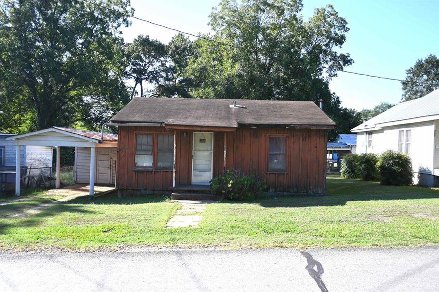 INVESTORS !!! Cute little house in the middle of Sheridan. 2 BR 1 BA complete w/ Original Hardwood Floors. Cute Jack n Jill closet between the bedrooms. Small carport w/ storage room. Lots of potential for this little house on a city lot. Walking distance from the High School and all the amenities in Sheridan. * Agents see remarks.