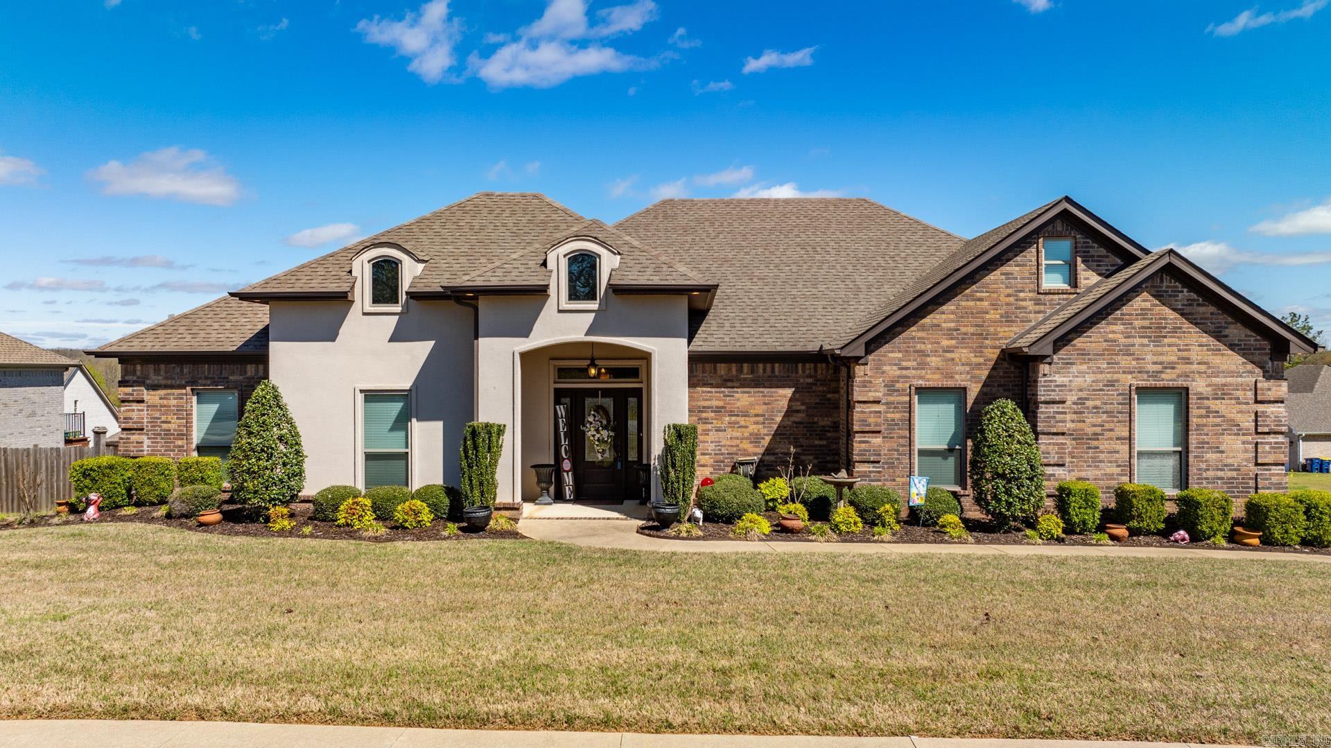 Immaculate Home in Greystone Subdivision - Like New! Welcome to this pristine home in Greystone, offering modern living and convenience. With easy interstate access, commuting is a breeze. The open concept floorplan maximizes space, highlighting a kitchen with custom cabinets, granite countertops, a gas stove, and a spacious pantry. Gorgeous trim work and hardwood floors. The master suite boasts tray ceilings, an ensuite with double vanity, tiled shower, jacuzzi tub, and a walk-in closet. Two additional spacious bedrooms, with a split floorplan for privacy. The walk-up attic offers future potential for a bonus room or 4th bedroom. Enjoy the covered back patio with a wood-burning fireplace and a large fenced yard, perfect for outdoor gatherings. Schedule a showing today! Agents see Remards