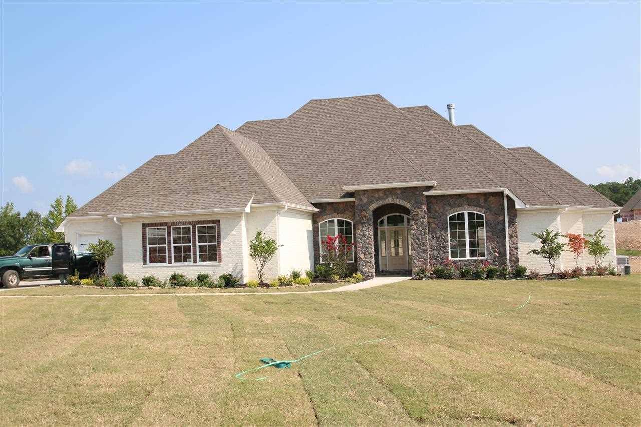 Beautiful home with rock and brick exterior. over sized 2 car garage and separate 3 car garage Very Open plan with huge island in kitchen. 4 bedroom, 3 full bath Plus a Office and Game room up stairs! High efficiency heat and air system! Beautiful master bathroom with huge shower Covered back porch is a 44X15!! Custom Fireplace with built-ins. All the nice trim through out, all interior doors are 8' tall.