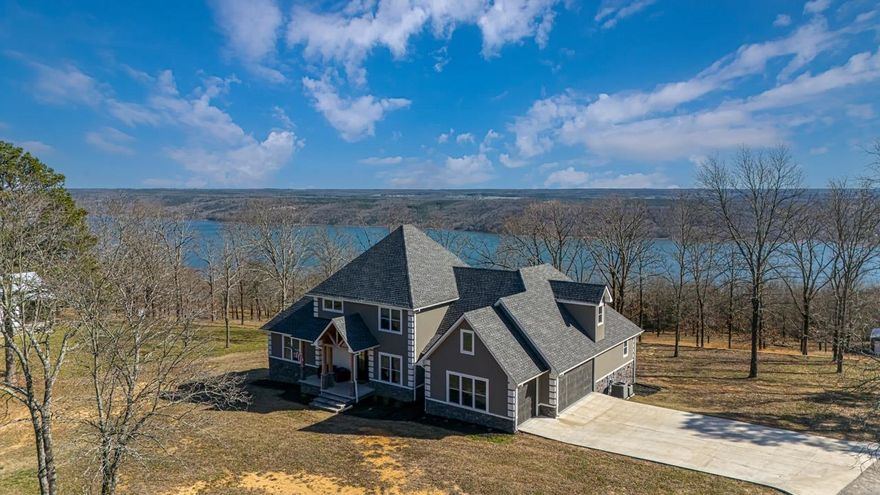 Lake Views!!! Nestled in the serene surroundings of Quitman, AR, this charming 3-bedroom, 3-bath home with a 4th bedroom or dedicated office space offers a perfect blend of comfort and tranquility. Situated on a sprawling 3+ acre lot, this property is an ideal retreat for those seeking space and privacy.  Spacious Living: Each bedroom is designed with comfort in mind, complemented by three well-appointed bathrooms. The 4th bedroom or dedicated office space provides a peaceful environment for remote work or study.  Modern Amenities: The kitchen and living areas are thoughtfully designed with modern living in mind, boasting top-of-the-line appliances and finishes.  Expansive Outdoors: The 3-acre lot provides ample space for outdoor activities, gardening, or simply enjoying the natural beauty of the surroundings.  Garage and Shop: includes an attached large 3-car garage, providing plenty of space for vehicles and storage. Additionally, the on-site shop offers space for hobbies, crafts, or additional storage.  Located on the quiet Honeysuckle Lane with views of Gerry’s Ferry Lake, you're just a short drive to boat ramp.   Virtual Tour:  https://my.mpskin.com/tour/5ntx9z1p47