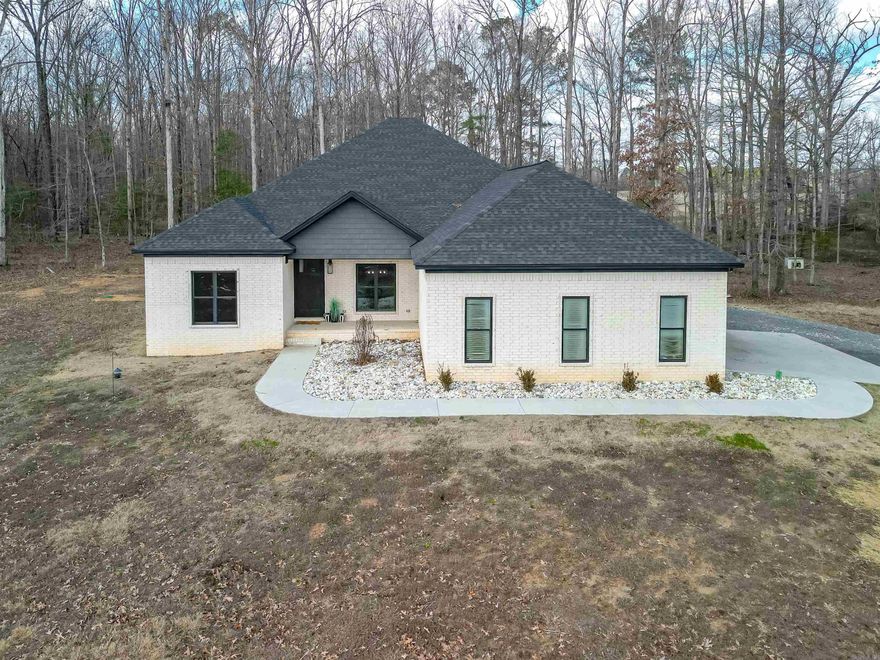 Welcome to this charming country retreat! This cozy 4-bedroom 2 full bath 2 half baths home is minutes from town. Spacious bedrooms. Enjoy the back porch while grilling on the hibachi grill .60x40 shop with a 10x60 lean too, with 1-bedroom, full kitchen apartment. Rent it out or it would be great for extra family. You don't want to miss looking at this amazing house!