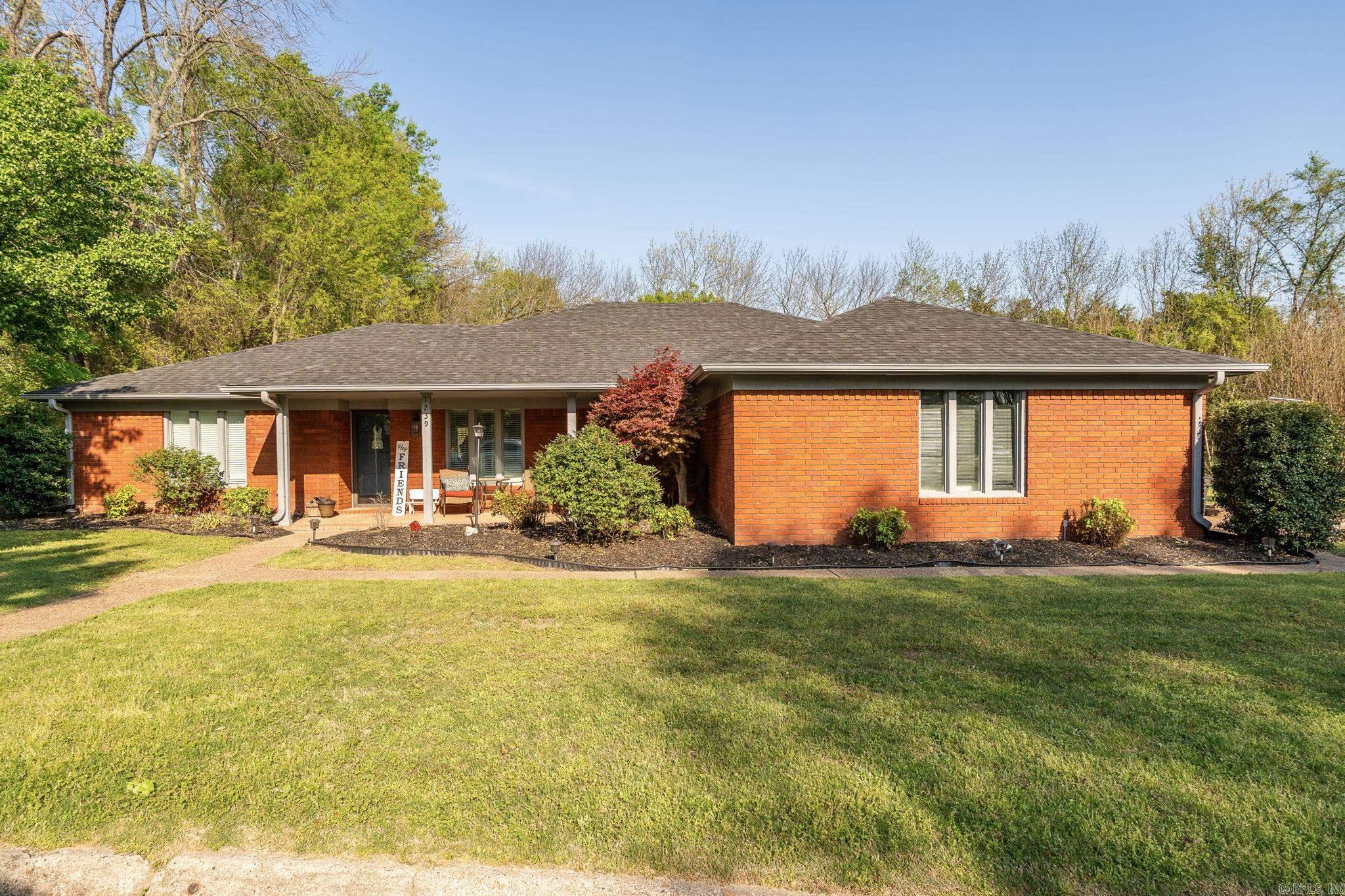 A rare opportunity to own a home in the highly desirable neighborhood of Chanticleer Estates. This beautiful brick home boasts 1876 square feet of open spacious living. Including 3 bedrooms, 2 bathrooms, cozy living room with fireplace and vaulted ceilings with gorgeous wood beams. The large primary bedroom has an attached office and/or work out room, and three closets! The updated kitchen features granite countertops, all newer appliances, and makes a great space for entertaining. The house is nestled on a large lot with a covered patio, woodland views with a wet weather creek and a relaxing front porch swing. Lots of upgrades throughout and a brand-new roof! Too many details to list!