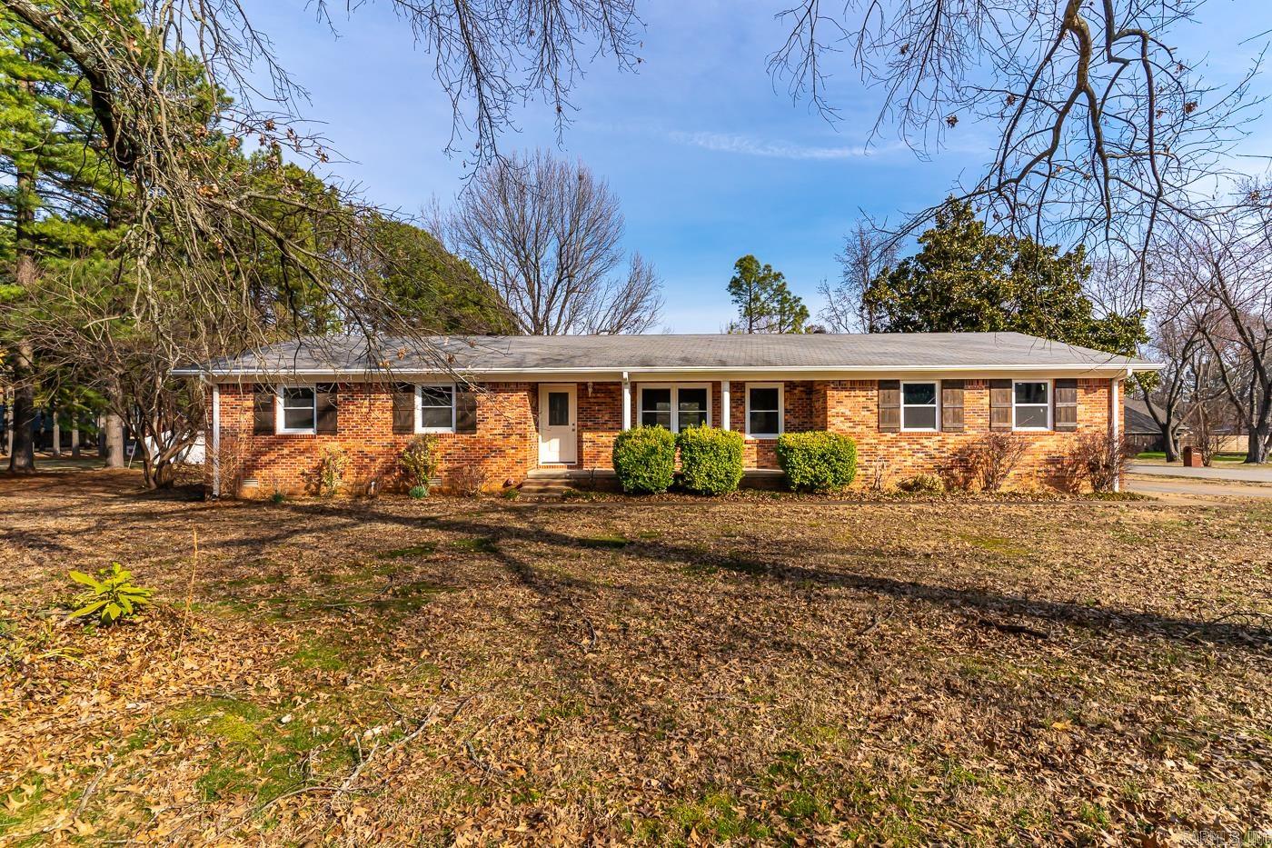 Welcome to the Market 4118 Hickory Lane of Jonesboro AR. Located in a quaint neighborhood in a convenient location near stores & restaurants. This beautiful, completely remodeled home sits on .76 +/- acres with the perfect amount of shade trees sprinkled on the lot. Gorgeous red brick wraps the exterior and the interior offers 2,400 sq. ft with 3 bedrooms, 2 bathrooms, kitchen, open concept dining/living room paired with a cozy fire place, and laundry room on the main floor. The lower floor offers a possible 4th bedroom with a storage room and access to outside. There is a brand new deck off the back of the home and a covered patio on the front. Sitting on the property is a storage shed with drive way ready to store all your lawn care. Attached to the home is a 2 car garage, including a spacious storage room and large shelves for your tools and storage needs.The home features large closets throughout, providing abundant storage space, complemented by expansive windows that invite abundant natural light into every room. Call today to schedule a tour for your new home. *Also available for rent, call for details.