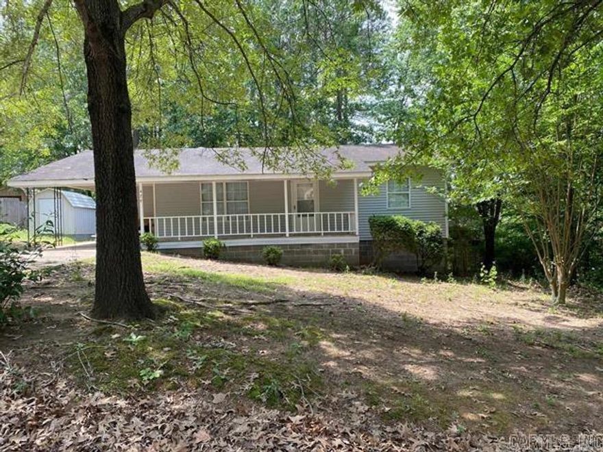 Heber Springs home close to the lake. This beautiful 2 bedroom, 1 full bath home is set on a corner lot with nice trees.  Home offers a large living room and bedrooms with utility room , carport and storage shed. Well maintained home updated in 2023, with new AC,  exterior and interior paint, appliances and flooring. Seller has since installed a new roof, new back yard privacy fence, had the ac duct work cleaned, disinfected and sanitized this year. Seller is relocating or would stay. There is 13 inches of insulation in the attic. New exterior water hose faucet and insulated. New smoke alarms. Solid wood cabinets in kitchen and new bathroom cabinet. This home is clean and ready to move in. Call today to schedule your appointment. No sign in yard.