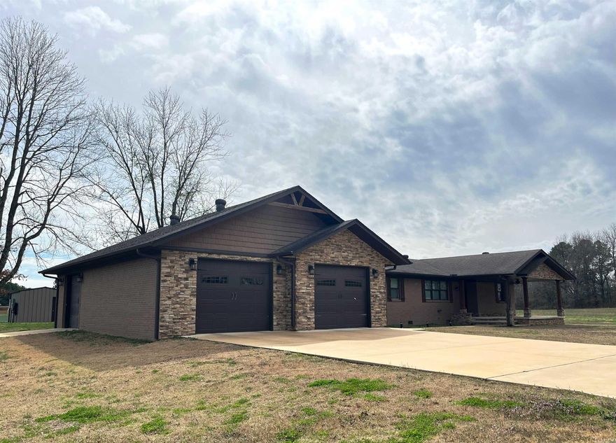 Beautifully remodeled 3 BR/2bath home on 6.3 acres just outside the Paragould city limits. This brick & stone home features a 22x10 covered porch, wood deck, garage w/3 overhead doors, storm shelter, backup generator, electric fireplace, hardwood floors, walk in tiled shower, and so much more! The house was fully remodeled in 2016 including HVAC, electric, septic, plumbing, windows, doors, fixtures, entire kitchen and master bath and garage. ADDITIONAL 5.7 acres with 6 stall barn, arena and 4 turnouts with access on GR 818 can be added  - See MLS #24007453