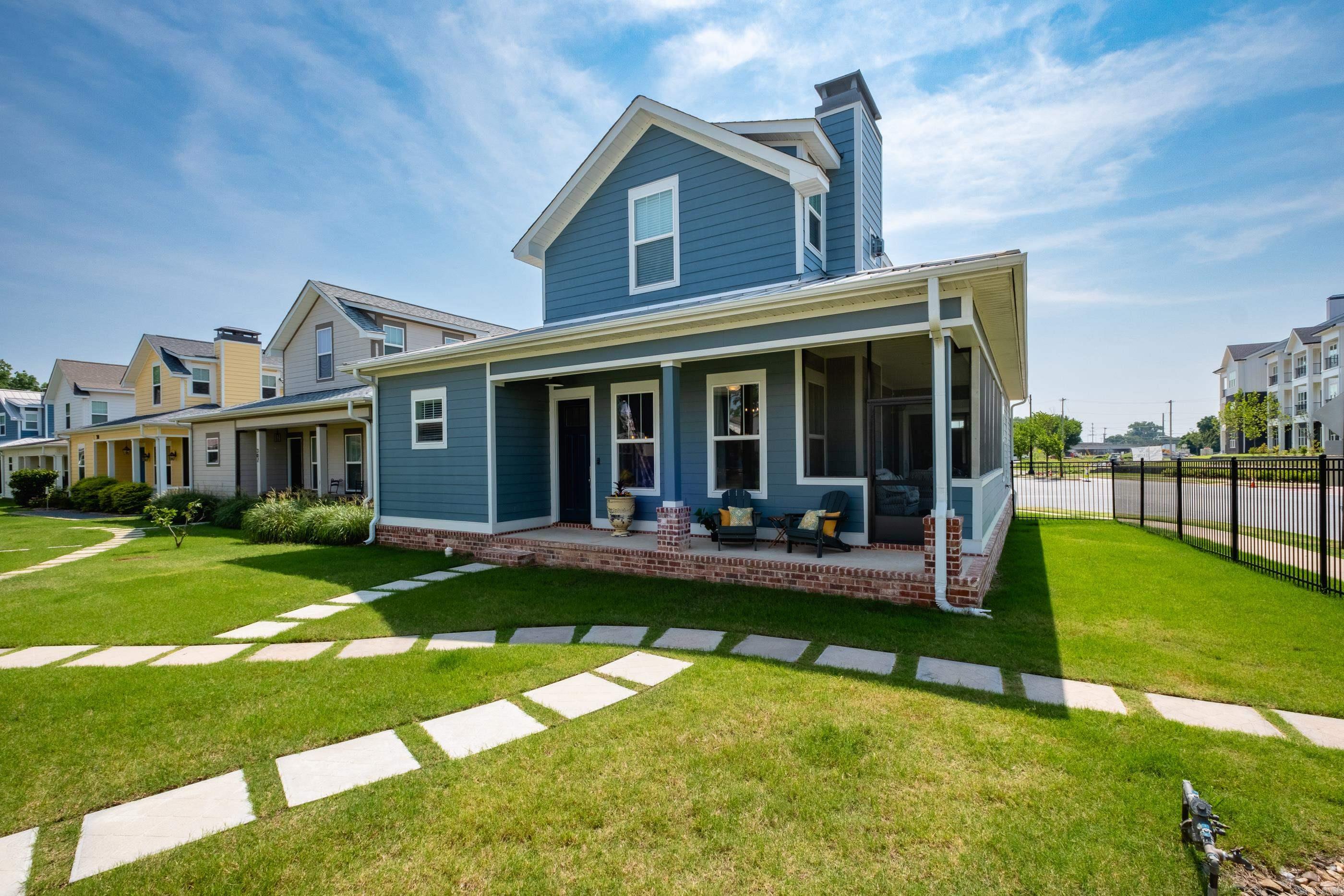 Enjoy living in The Porches of Rockwater neighborhood located just steps from the Arkansas River Trail. Youāll enjoy immediate access to miles of scenic paved trails, as well as the full-service Rockwater Marina. You're also just minutes from the vibrant Argenta District and downtown Little Rock & North Little Rock, offering endless dining, entertainment, and cultural experiences. This stunning home features Pella doors and windows throughout and 10' ceilings on the main level. The open-concept kitchen, living & dining area is perfect for entertaining, with luxury vinyl plank floors, a cozy gas fireplace, and quartz countertops. The first-floor primary suite opens directly to a screened-in porch. A laundry room and a convenient half bath are also located on the main level. Upstairs, you'll find two additional bedrooms and a full bathāideal for guests, family, or a home office setup. Additional highlights include a metal roof, a rear-loading garage, and a cozy front porch for relaxing outdoors. The HOA covers lawn care, fire pit maintenance, and fencing - giving you more time to enjoy your beautiful surroundings. Agents, please see remarks.