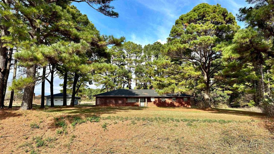 The Woodruff County Camp is situated on approximately 1.3 acres in wildlife rich Woodruff County, Arkansas.  Abundant public land access points, both federal and state, are within a few minutes drive as well as the famed Cache River.  The property itself was built in 1960, sits on a slab, has central heat and air, a detached garage with lean-to on the back, as well as an enclosed back porch.  The three bedrooms are all oversize and will accommodate larger furniture or bunks and all your equipment.  One full bath is a few steps from each bedroom and the other full bath is in the large laundry/mud room.  Augusta, AR is within sight of the property if you need fuel, groceries, bbq or a sandwich.  Although it sits off the highway, it's a very quaint property with large trees that has a very homey feel.  Plenty of room for several trucks, trailers and boats to park.  Give us a call, we'd love to show it to you.