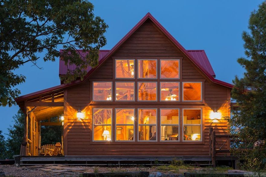 The Hilltop Cabin is a great escape into the Ouachita Mountains. This fully furnished cabin has been a successful vacation rental for over 10 years.  Situated on approximately 11.77 acres with 360 degree mountain views, a national forest boundary and a year round creek. The exterior of the cabin has a new coat of stain. The wood floor is newly finished and the kitchen cabinets have been freshly painted. Beautiful views from the array of windows that grace the two-story living area, allowing for natural light and amazing views of the stars at night. Decks on two sides of the cabin provide plenty of room for entertaining. Privacy is the extra bonus with this hilltop setting. Make this your private residence if you prefer, or keep it as a money-generating vacation rental. If you want to operate these as a vacation rental business, the bookings are plenty and the business comes with a fully functional web site that will transfer to the new owners. All signage and logos are also included. Don't miss this opportunity to by a slice of the Ouachita Mountains! Also offered with an additional cabin for more acreage - see MLS#25048629.