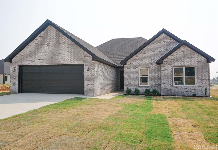 Be the first to own this beautiful brand new home in the Hidden Creek neighborhood. Located in the heart of Brookland just moments from Brookland schools.This single family home has an open concept living area with over 1900 square feet of living space. Home features an electric fireplace and large windows to bring in natural light. Eat-in kitchen is accented by tile backsplash, quartz countertops and a stainless steel appliance package (gas range, built in microwave and dishwasher. The alluring master suite features dual vanities, walk in closet, large tile shower and soaker tub.A relaxing backyard retreat features a covered porch and spacious grassy area.  Don't miss your opportunity to make this your forever home in this growing community.