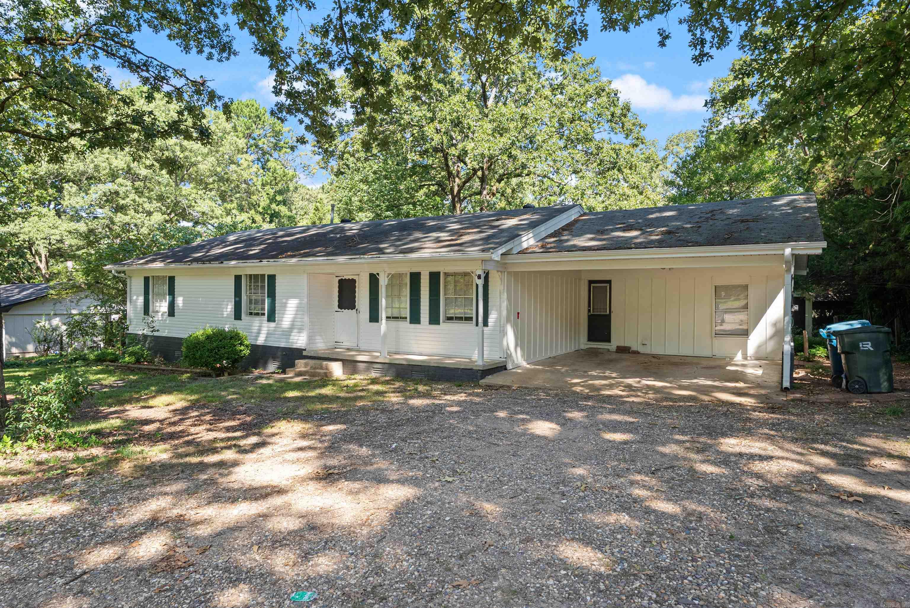 Back On The Market!! Walls Newly Painted!! Nestled on a lush 0.7-acre lot with mature shade trees, this charming 1955-built single-level traditional offers 1,604 sqft of comfortable living in the serene city of Alexander. The stylish brick-and-vinyl exterior hosts a two-car carport. A spacious, fenced backyard creates a private, park-like retreatāperfect for outdoor living and entertaining. Inside, discover a 3-bedroom, 2-bath floor plan. The living room centers around a brick fireplaceāideal for those relaxing evenings. A generous laundry room adds everyday convenience. Come tour this amazing home, that boasts a welcoming environment with room to gather!