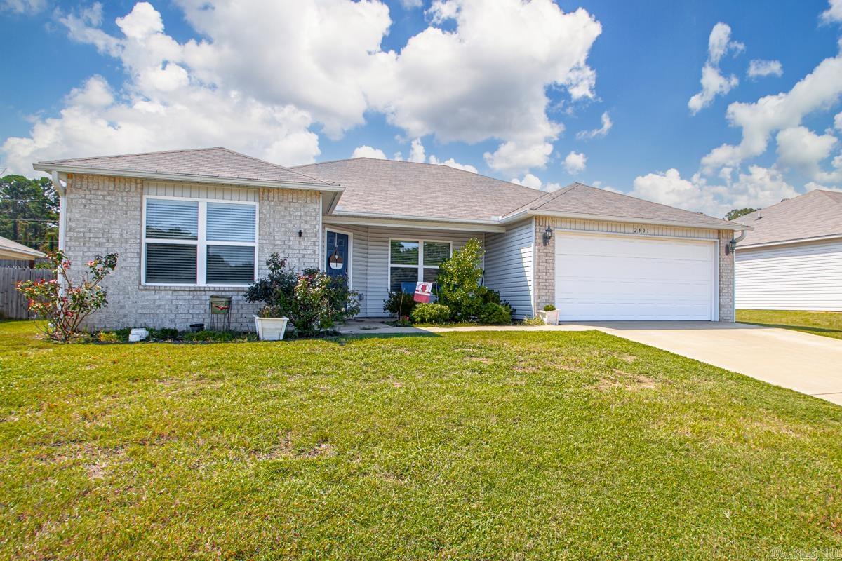 Welcome to 2401 Kenneth Drive! Experience modern living in this beautifully designed 4-bedroom, 2-bath home with a spacious split open floor plan, offering both comfort and privacy. The kitchen seamlessly connects to the living room, which features vaulted ceilings for an airy feel. A full-sized laundry room is conveniently located near the garage entrance. The primary suite boasts a large walk-in closet and a bathroom with built-in linen shelves. Step outside to enjoy the patio and fully fenced backyard. Ideally located near top restaurants, shopping, and amenities, this home combines convenience with exceptional features. Make this beautiful place your new home!