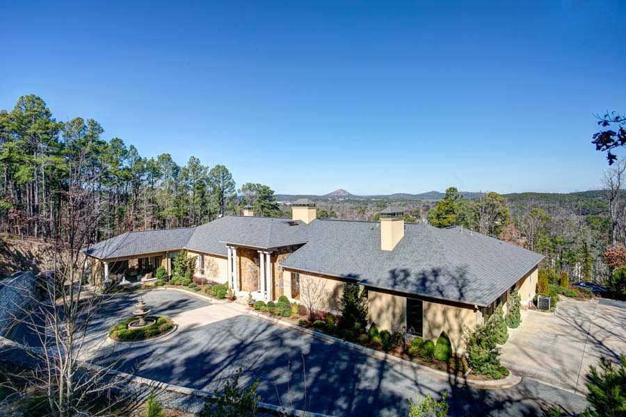 Spectacular custom home boasts sweeping views of WLR. This sophisticated home is perched high above the gated Hickory Pointe neighborhood and rest on over one acre. Primarily a one level home, the home offers multiple living and dining areas; three large bedroom suites, library/study, all on one level. Upstairs offers a game room or hobby area with a half bath. Additional features included three fireplaces, pool, three car garage and beautifully landscaped grounds. This home offers the ultimate in privacy