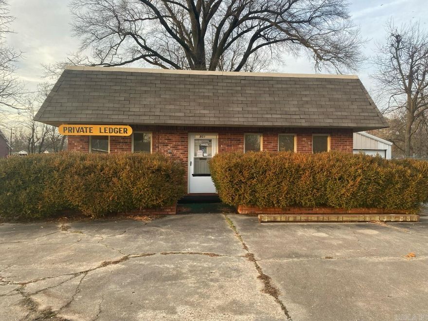 This office has 832 sq ft of space, and sets on .44 Acre just off hwy 49 in Rector. This Office has 2 office rooms, 1 bath, a Kitchen, and a 3rd room that could be another office or use for storage depending on your needs. This office does come with a 2 car garage with electricity, has a concrete parking lot, and a partial chain link fence. Listed @ $60,000