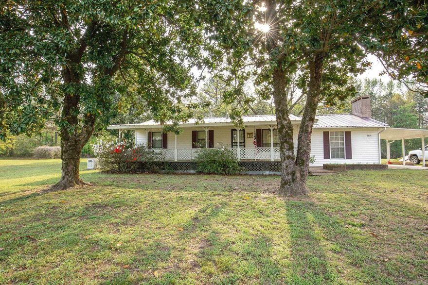 Looking for peaceful country living with room to grow? This charming older home offers endless possibilities.  Nestled on 4.52 acres, this property has a workshop and large carport shed with additional homesite potential also. Another older septic on the property and a concrete pad. The home offers 1286 sq ft with a functional layout, (previously a 3/1) now 2 bedrooms and 2 full baths, and a cozy fireplace in the large living room. The home has great bones and there is plenty of opportunity to make it your own.  There is a storm shelter & Generac generator! The metal roof is approximately 6-7 yrs old. Room for animals & gardening! Bring your vision and make this property shine!