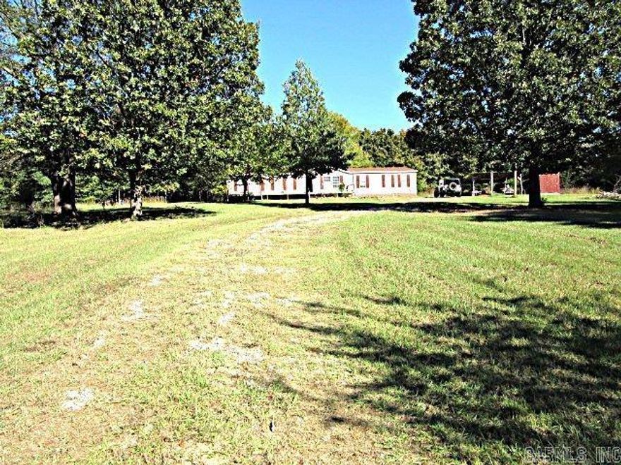 Large four Bedroom Two bath mobil home setting on 3.16 acres in a quiet subdivision. Mobile home needs some work.