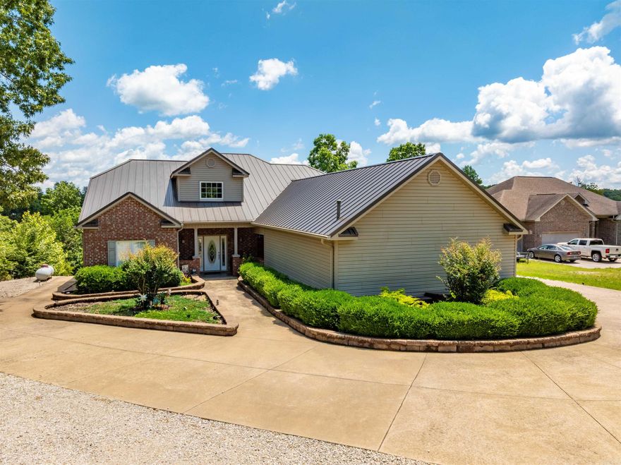 Stunning Waterfront Home on Crown Lake – 4,200± Sq Ft, Move-In Ready!  This beautiful 3 bed, 3 bath custom-built lakefront home offers approx. 2,100± sq ft on the main level and 2,100± sq ft finished walk-out basement—perfect for full-time living or a lake retreat. Enjoy panoramic Crown Lake views from soaring living room windows, vaulted ceilings, and a cozy fireplace. The kitchen features bar seating, a dining nook, and opens to a screened-in porch overlooking the lake.  The main level includes an office or formal dining room(which ever a person decides to use it for), guest bedroom, full bath, and a spacious primary suite with bay windows, double closets, and ensuite bath. A large laundry/pantry leads to a covered carport and 3-car garage.  Downstairs offers a massive rec room, bedroom, bath, kitchenette, and two oversized craft rooms—one ideal for a theater. Step outside to a covered patio, private boat dock, fire pit area, and low-maintenance landscaping.  Bonus: Seller added a new furnace and heat pump in 2023. Located in peaceful Horseshoe Bend, AR, near golf, trails, and three lakes.  Ready to move in and enjoy lake life!