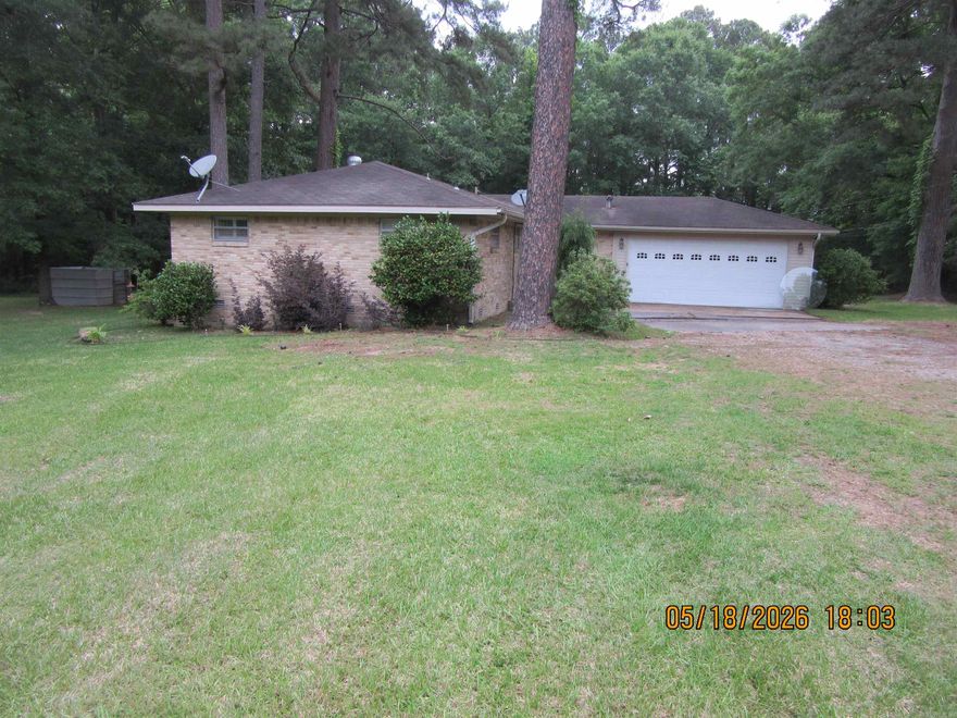 Well maintained brick home and 2 acres just outside city limits. Updates include kitchen, flooring, fireplace, and handicapped design shower in master bath and much more. Also included is a 20x20 shop that is wired and lean to storage. Wood deck in back yard for parties or just relaxing.