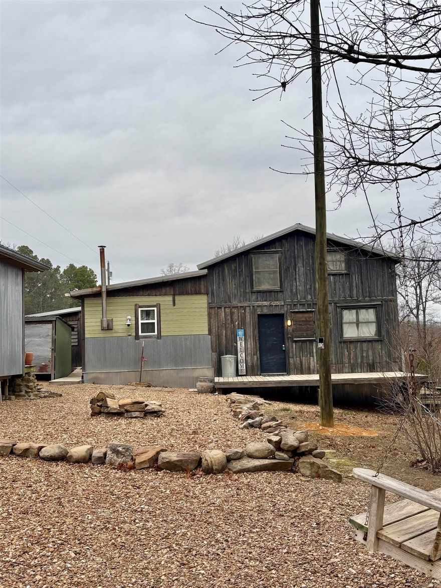 This is a beautiful property in the country just outside of Mountain View. It is listed as a 2-bed, 2-bath, However, in the upstairs area there is plenty of room for more bedrooms/sleeping space. It also includes a mother In-Law suite perfect for guests, an office, or workshop. The property has multiple out buildings. Some are for storage, some for firewood storage, a chicken coop, and an old home. The old house is falling down and does not hold much value, but some materials from it may be reusable. There is also a beautiful garden area that is fenced in, and has lots of varieties of flowers, plants, and fruit trees. The main house offers a new central heat and air system as well as a walk-in closet, gas and wood burning ranges, built-ins, office and storage space, and a separate laundry room. Just a short drive away from the town of Mountain View, and all the local amenities. Which included, restaurants, shopping, hiking trails, The White River, and The Ozark Folk Center State Park, and so much more. This is definitely a one-of-a-kind property and is a must see. Call today to set up an appointment.