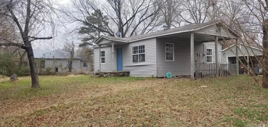 This two bedroom, one bath house needs a lot of repair but could be a good investment property. It is on a corner lot & a one car carport. to be sold "As is" & only cash or in-house construction bank loan offer will be considered. No property disclosure will be available. Needs a lot of work so may be a tear down or a total remodel.