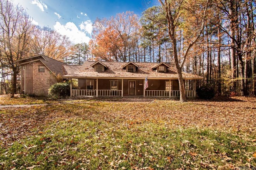 Massive 4 bedroom 4 bath home features high ceilings, large master bed and bath down stairs, large living area, three bedrooms, and two bathrooms upstairs, with a beautiful front porch and fenced backyard.