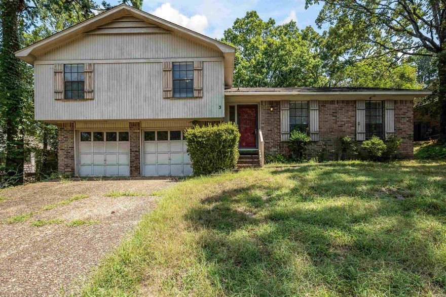 Looking for a prime opportunity in a sought after area of West Little Rock? Here is your sign! 3 Heritage Court is some TLC away from being the Pleasant Tree gem has been in the time since being built. The neighorhood has sprawling yards, trees, and trails in a hillside setting that feels like a retreat away from the hustle of the rest of the City - but the location affords excellent city access. The classic tri-level, wood siding, and brick combination makes for an inviting extrerior, featuring a 2-car garage on the lower level, family living on the main floor, and all bedrooms on the second. Spend time around the fire in the family room, or hang out in the front living room. There is plenty of space to enjoy family time. Check out this property and make Pleasant Tree sub your next home!