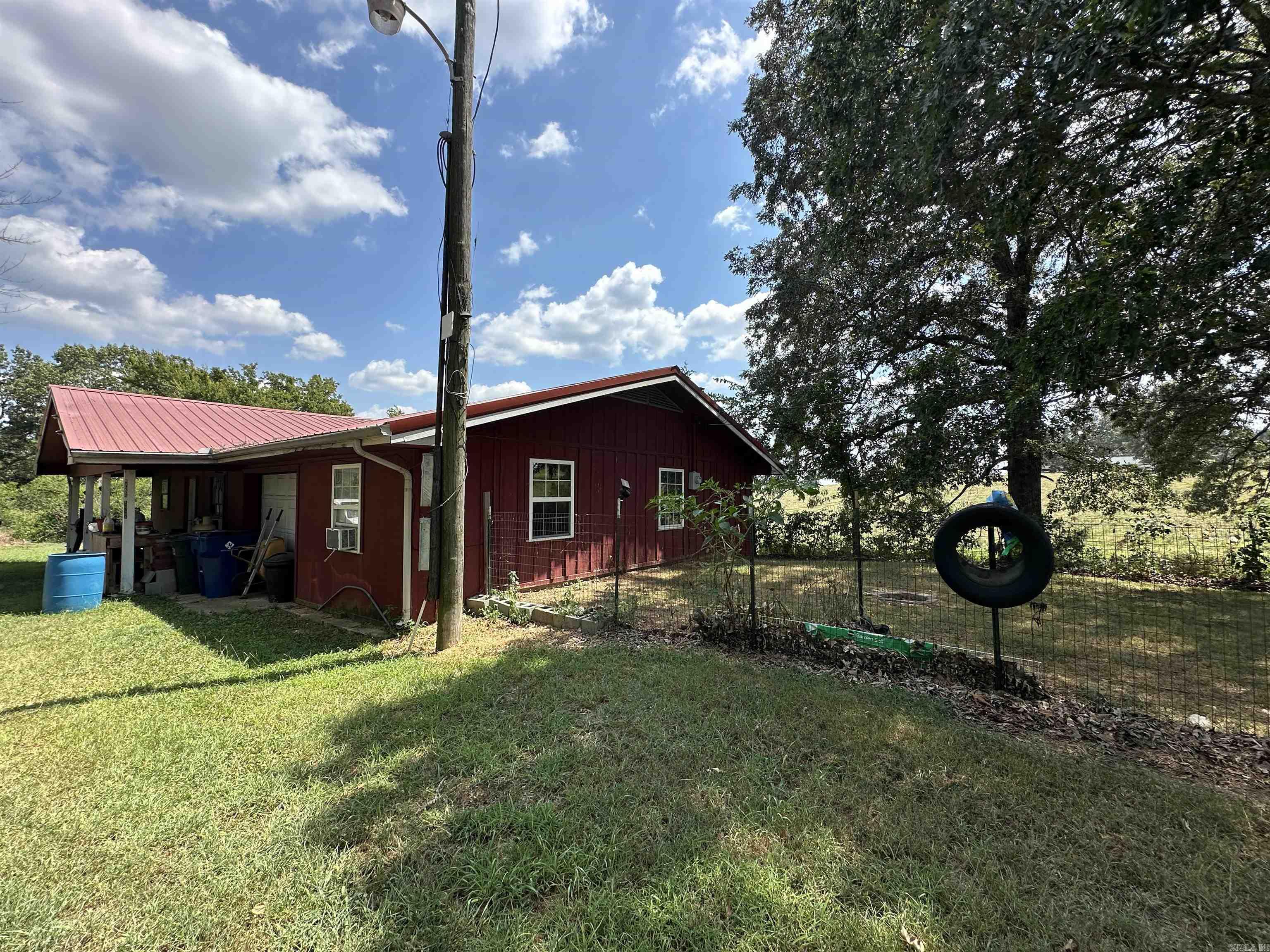 Investor Special – 2-Bed, 1.5-Bath on 1.5± Unrestricted Acres with Shop, Garage & Bonus Room! Just outside Harrison, this solid-bone home is bursting with potential! Featuring a metal roof, one-car attached garage, and a bonus room off the garage perfect for a man cave, hobby space, or office. Inside, you’ll find a classic claw-foot tub, another half bath for convenience, and plenty of room to customize. Outside, enjoy a shop for projects or storage, city water, septic, and an old well that could be put back into service. Central air is in place (currently not working), but the structure is ready for your updates and vision. With 1.5± unrestricted acres, there’s room for animals (even a fenced in yard), gardening, or expansion—plus no HOA to limit your ideas. Priced to move, this is the kind of opportunity investors and DIY-ers dream about!