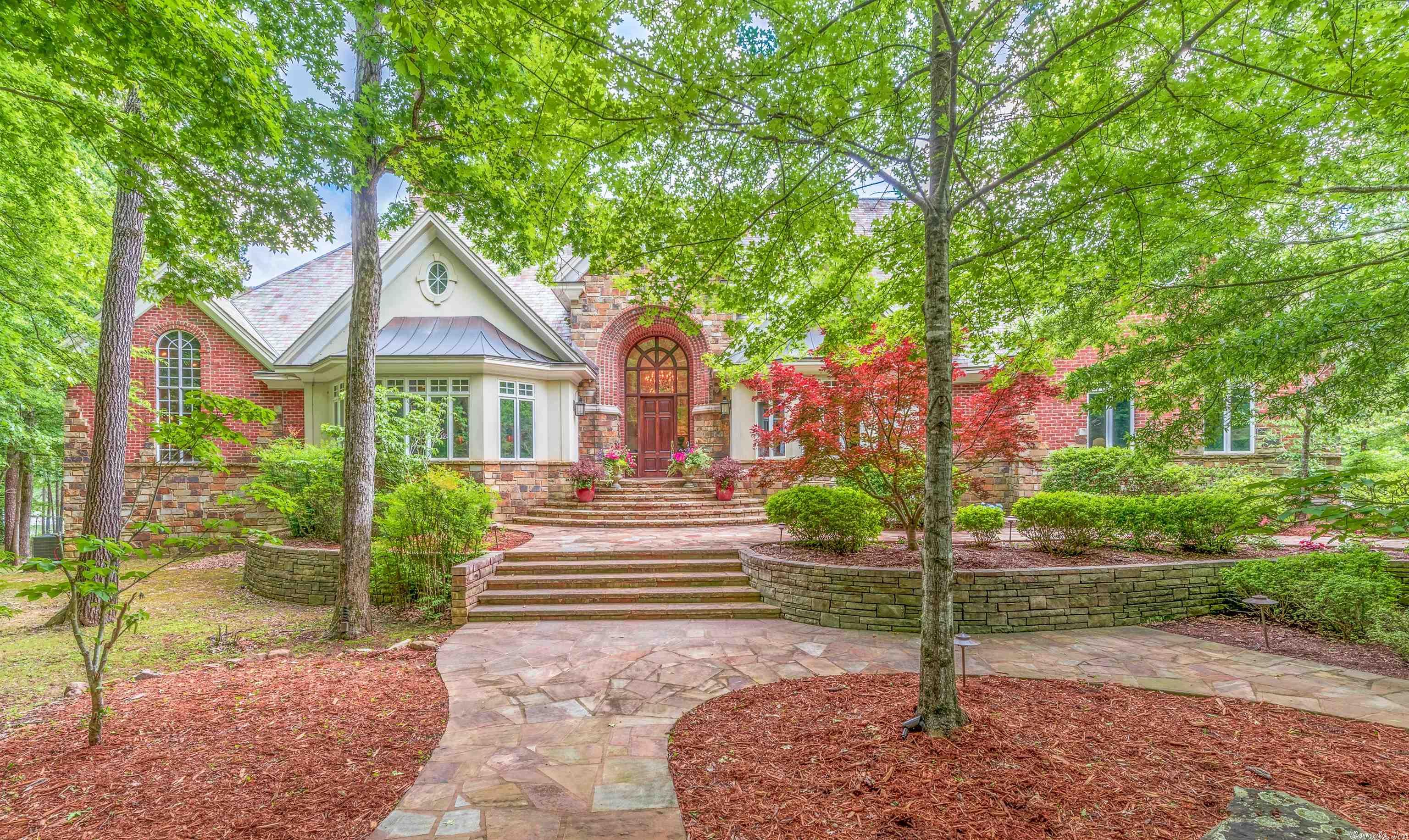 This home and acreage are just stunning, home on approx 42.68 acres with opportunity to purchase more acres. There is a 12 acre spring fed lake that is fully stocked. The views of the lake can be seen from most of the rooms on the back of the home. 4 large bedrooms, 4 bath rooms, 2-1/2 baths. Kitchen offers great storage, breakfast bar and great counter space. Walk in pantry has pull out drawers, space for another refrig and counter space. 2 central vac systems, extra storage under the house, 3 fireplaces, extensive crown molding, and a three car garage. Outdoors you will find 2 screened in porches, koi pond, fire pit, covered dock and a boardwalk across the lake. Extra garage space on backside of home. Located approx 19 miles to the Wal-Mart on Chenal Parkway and Hwy 10. There are many other great features of this home- see associated documents. AGENTS be sure to check associated documents for very impt info.