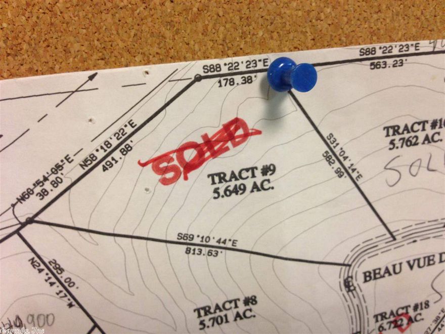 Fabulous view of AR River and Pinnacle Mtn. near end of cul-de-sac. Gated area with high tech security system.  POA dues $70.00 per month, per lot.  One time fee of $1,000 per lot for future road repair.  5 acre tracts in the city with all utilities. Some have fabulous river views.  Some lots need pump for sewer.  See showing remarks. Taxes to follow.