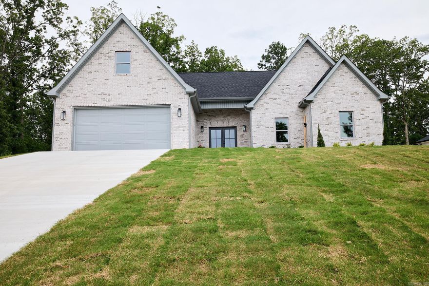 NEW CONSTRUCTION in the lovely Hidden Forest community in LHSD! You MUST SEE this stunning modern home with spacious open concept design! The island kitchen is at the heart of the home. You will fall in love with the Taj Mahal Countertops and champagne bronze hardware adorning the custom cabinetry. You will be surrounded by elegant finishes and contemporary elements throughout! The large laundry room features built-ins enhancing functionality. The overall design radiates a modern and welcoming atmosphere, perfect for contemporary living. The Primary suite with walk-in closet, has an inviting soaker tub and custom shower!
