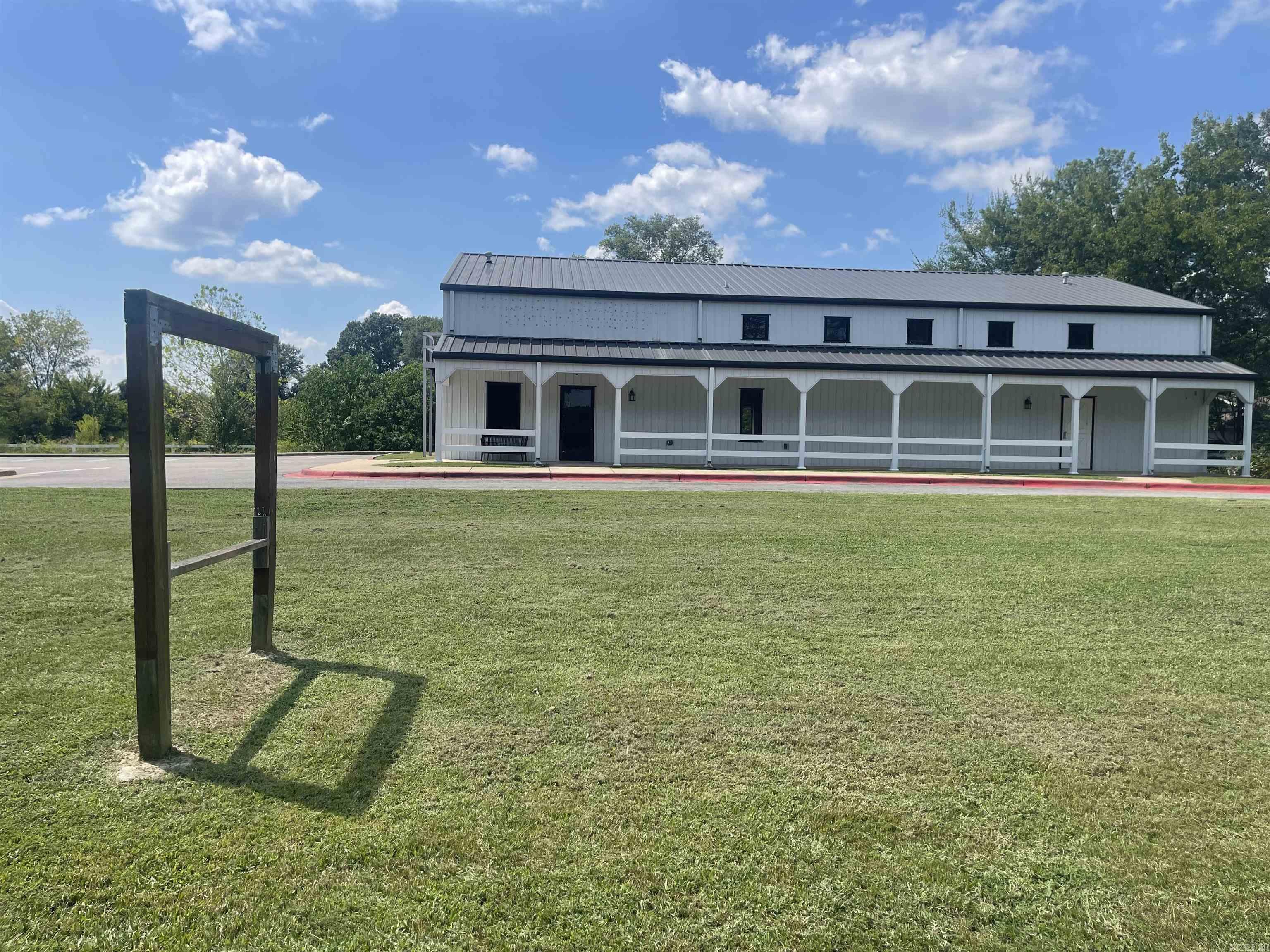 City has zoned for many uses. Prime location for your event center, business, church, school or so many other opportunities. Offering a kitchen, 1 full bath and 2-1/2 baths, office, a loft and large open area. Interior has been recently painted. Building is situated on 1.6 acres.
