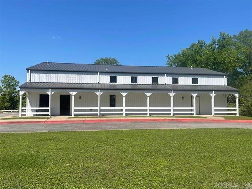 City has zoned for many uses.  Prime location for your event center, business, church, school or so many other opportunities.  Offering a kitchen, 1 full bath and 2-1/2 baths, office, a loft and large open area.  Interior has been recently painted.  Building is situated on 1.6 acres.