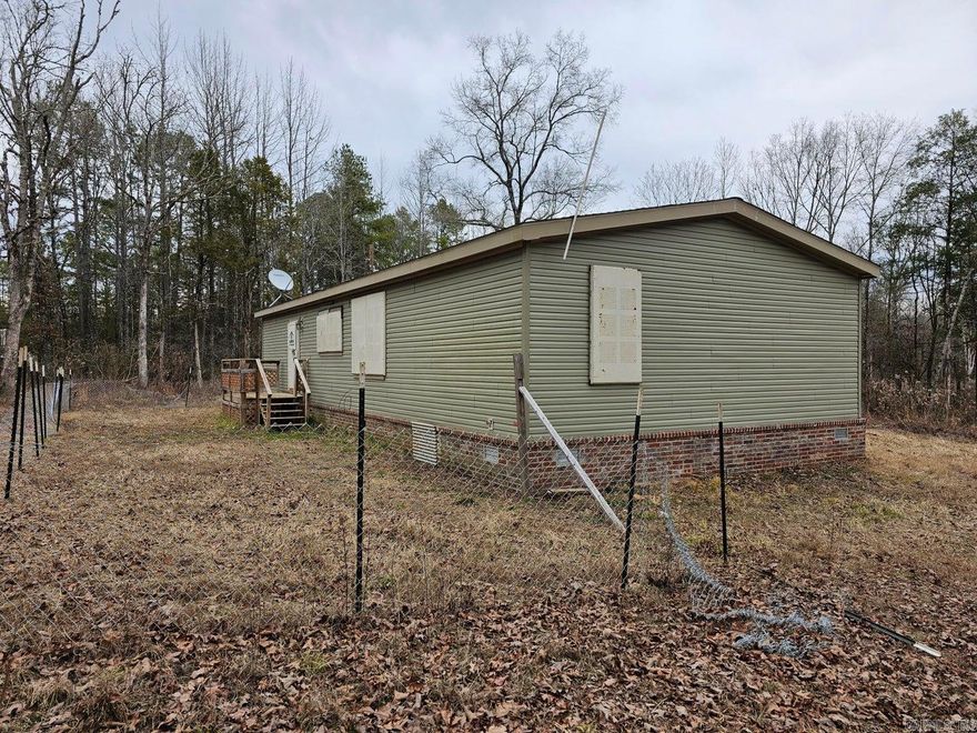 This 2021 3 BD, 2 BA manufactured home has a permanent foundation and sits on just over 3 acres. It has an open kitchen/dining/living and a split floorplan. The property is being sold AS IS.