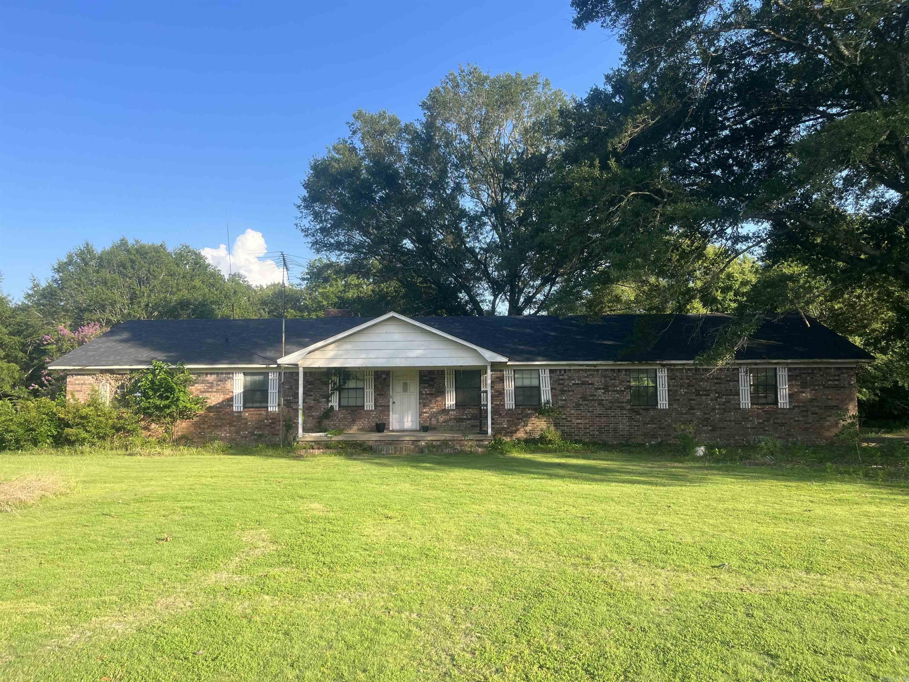 This 3-bedroom, 2 bath home sits on an expansive 9.11 acres (approx.). Inside you will discover approx. 1,601 square feet of functionality. The master is separate from the other bedrooms, and a beautiful fireplace sits amidst the living room and kitchen. Enjoy your time outside fishing in the pond or working in the shop. Adding to the property's appeal is an existing mobile home that currently generates rental income. Don't miss out on this one!