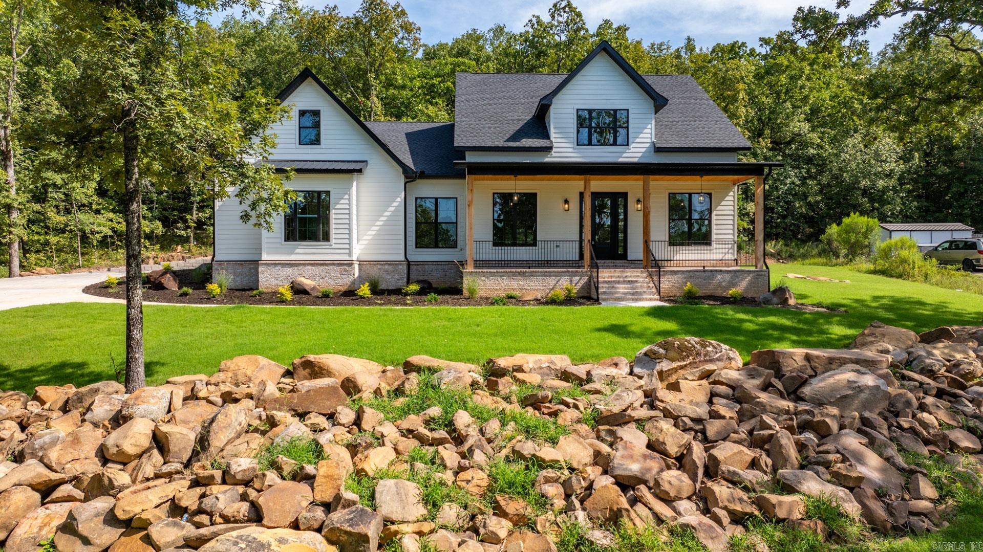 You won't find a better deal than this in Central Arkansas for what this property offers! Step inside this elegant BRAND NEW home to 10' ceilings and 8' doors throughout the main level which boasts 4 bedrooms and 2 full bathrooms in a split floorpan layout! The open kitchen-dining-living area make it perfect for entertaining family and friends! In the beautiful kitchen, you will find quartz countertops, cabinets that go to the ceiling, high end appliances, backsplash all the way to ceiling and tons of natural light! The primary suite boasts a huge walk in tiled shower with frameless glass, double vanity with make up station that has the perfect amount of natural light, and a soaking tub! Walk up stairs to find the perfect place to send the kiddos! On one side of the upstairs you will find a HUGE bonus room, and on the other side you will find a second bonus room/another bedroom with TONS of storage and a full bath! All of this sitting on 1.68 acres and beautiful finishes throughout the exterior of this home! You dont want to miss this one! Call your agent today to schedule your showing!