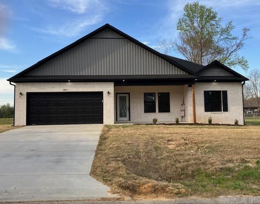 This 3bed 2bath home offers a spacious three-bedroom, two-bathroom layout with an open split floor plan spanning approximately 1,500 sq ft and featuring 9-foot ceilings throughout. The living room boasts vaulted ceilings, while the master suite includes a tray ceiling for added elegance. The kitchen is equipped with custom cabinetry featuring soft-close doors and drawers, a walk-in pantry with ample shelving, and modern quartz countertops that flow into a breakfast bar illuminated by stylish pendant lighting. Elegant fixtures enhance both the kitchen and baths, which feature marble finishes and double vanities. The primary suite offers a walk-in shower with a rain head, a generous walk-in closet, and refined details.  Additional amenities include a garage with extra storage space, a comprehensive appliance package—stove, dishwasher, refrigerator, washer, dryer, and a 65” TV—as well as remote-controlled interior and exterior ceiling fans. The all-brick exterior and architectural shingles ensure both lasting beauty and durability. This home will be covered by a 2:10 Home Warranty and is situated within the Floridian Heights Subdivision.