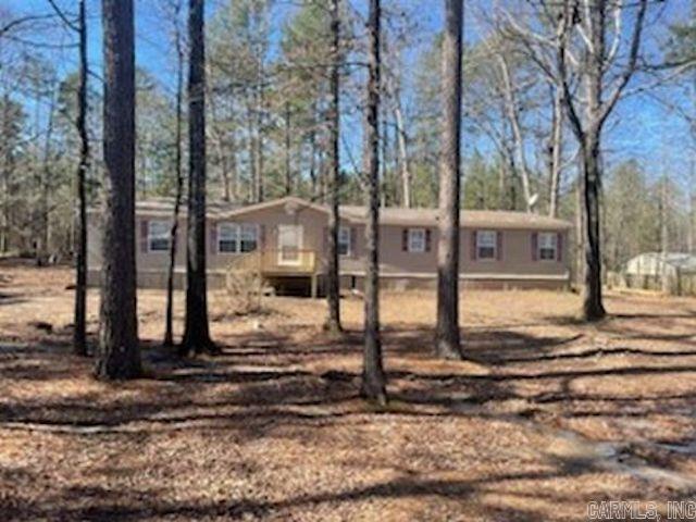 Charming 4-Bedroom, 2-Bath Double Wide Home on 1 Acre This spacious and well-maintained double wide mobile home offers 4 bedrooms and 2 full baths, providing ample space for family living. Situated on a most 1-acre lot, the home features an open floor plan with a large living area perfect for entertaining. The kitchen is equipped with plenty of cabinet space, and a dining area for family meals. The home has all new flooring, new paint and mini blinds