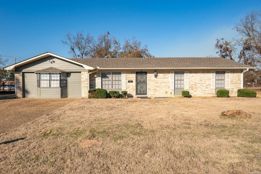 This home is a MUST SEE! Like new!  Completely updated with new kitchen, baths, flooring, paint and more.  2 living areas along with a lovely sunroom.  Kitchen has quartz counter tops, new cabinets, stainless appliances.  Huge backyard with fruit trees.  Detached garage with storage.  Don't miss it!