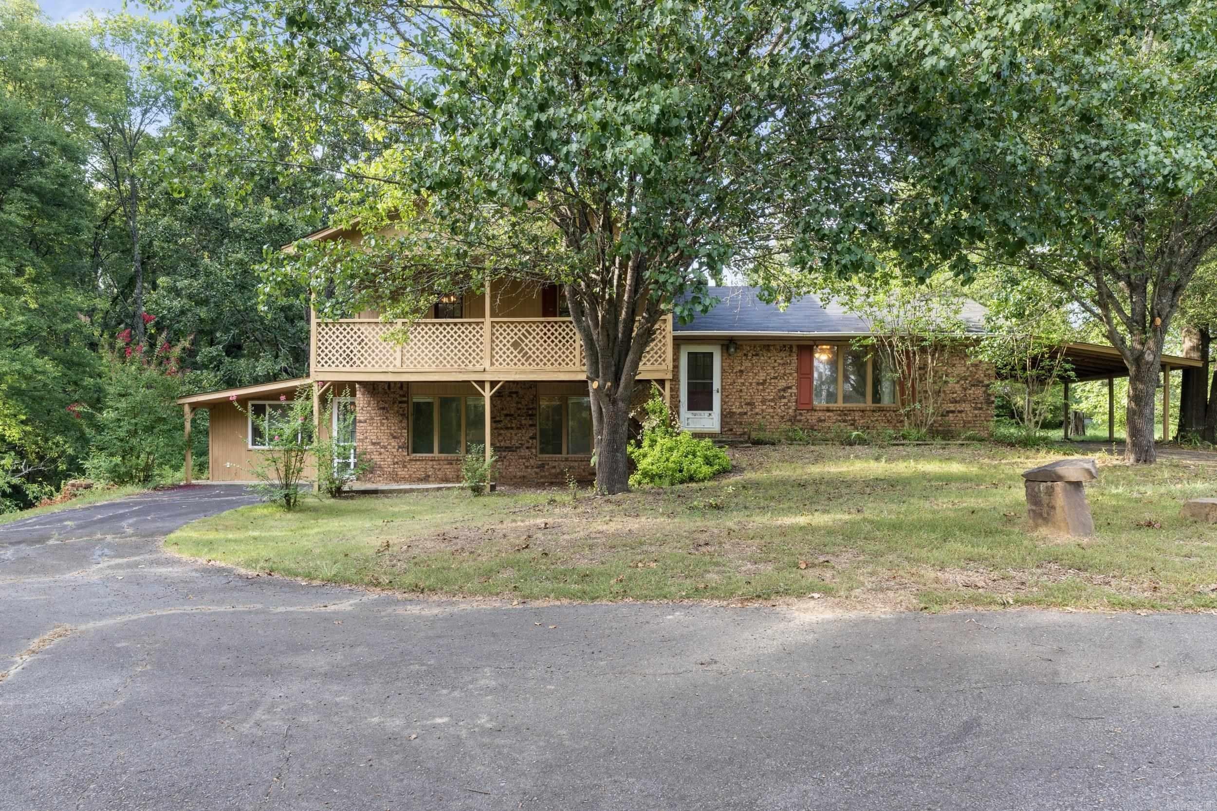 Attention Investors! Donāt miss this opportunity to purchase a 3-bedroom, 2.5-bath home on 2.22 acres featuring a PONDājust six minutes from I-40! This tri-level home has a unique floorplan with a bathroom on each level! There's even an option to have a large additional living area or a 4th bedroom! With some TLC, this could be the perfect opportunity to renovate and create your dream home or investment. The land itself is a standoutāpeaceful, private, and full of possibilities. It is ready for your personal touch! Measuring encouraged. SEE AGENT REMARKS