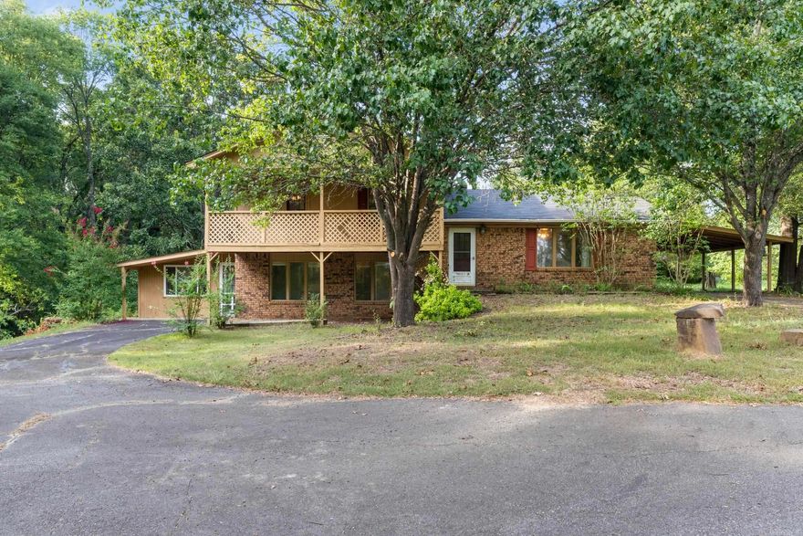 Attention Investors! Don’t miss this opportunity to purchase a 3-bedroom, 2.5-bath home on 2.22 acres featuring a POND—just six minutes from I-40! This tri-level home has a unique floorplan with a bathroom on each level! There's even an option to have a large additional living area or a 4th bedroom! With some TLC, this could be the perfect opportunity to renovate and create your dream home or investment. The land itself is a standout—peaceful, private, and full of possibilities. It is ready for your personal touch! Measuring encouraged. SEE AGENT REMARKS