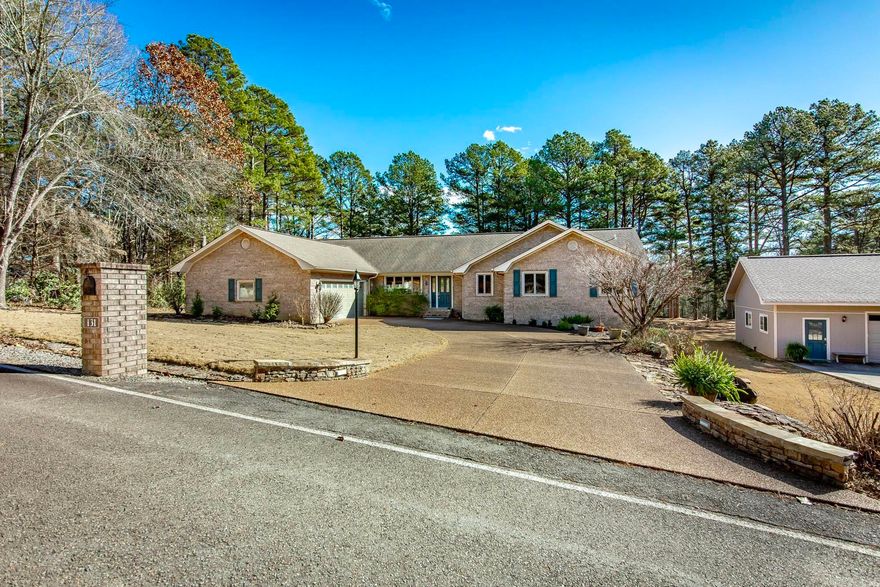 Welcome to effortless living on the 11th green of Mountain Ranch Golf Course! This beautiful one-level, all brick home offers the perfect blend of comfort, style, & low-maintenance—ideal for full-time living, or a second home near the lake. Inside, you’ll love the open, sprawling floorplan featuring gorgeous wood flooring, fresh paint throughout, new appliances, & stunning quartz countertops. The inviting living area is anchored by a beautiful stone fireplace, creating a warm & welcoming space for relaxing or entertaining. A den and separate office provide plenty of flexibility for guests, hobbies, or working from home. The oversized primary suite is a true retreat. Step into the screened-in room, overlooking the golf course offering the perfect spot to unwind after a day on the course or at the lake. Outside, you’ll find exceptional extras including a 24’ x 36’ detached garage with heat & air, a half bath, that is fully insulated and finished--ideal for a workshop, storage, or recreational space. There’s also a detached carport plus an RV hookup with electric, water, and sewer. This home has been meticulously maintained & comes mostly furnished.  Come enjoy golf course living.