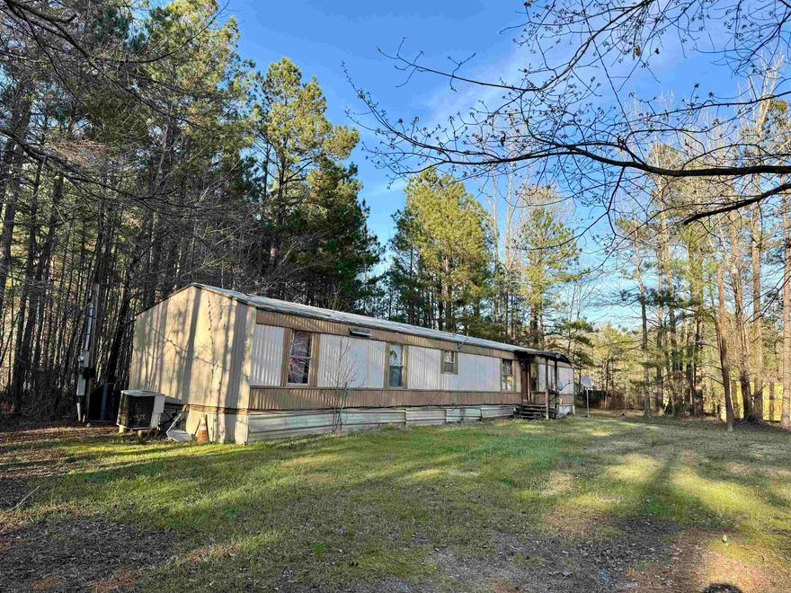 Here's your chance at an investment deal of the year! 3 bed/2ba, 1232 sqft, mobile home is a fixer upper; with some TLC, you can make it an investment or your home! Utilities are not turned on. Damage in the roof/ceiling and a little squeaky floor in some areas. Could be hazardous. Sold as is. Agents see remarks.