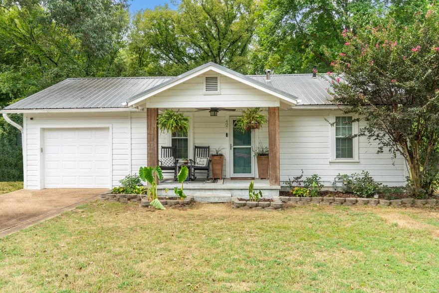 This adorable white house sits right in the heart of downtown Judsonia, and it’s full of character and warmth. Offering 2 bedrooms, 1 bathroom, and a 1-car garage, all thoughtfully updated to blend comfort with efficiency. The beautiful wooden posts out front add a touch of farmhouse style, and the spacious backyard is perfect for enjoying time outside. The kitchen has been thoughtfully remodeled, and the walk-in tiled shower adds a modern touch to the bathroom. More recent upgrades include a new heat and air unit (2023), new insulation (2023), a tankless hot water heater and a new sewer line installed in 2024, giving peace of mind for years to come. The home was repainted last year, has gutters, a storm door on front, metal roof, tile in kitchen and bathroom, and hardwood throughout the rest. Love! Also, the home has energy-efficient windows that keep the home comfortable year-round. With so much care poured into this property, it’s truly move-in ready and the coziest haven you'll find. Whether you’re looking for your first home, wanting to downsize, or simply wanting something with character in a convenient location, this Judsonia gem is one you need!  Schedule your tour today!